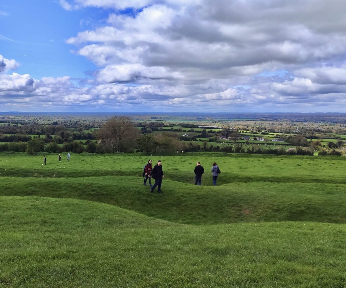 people enjoying walk in nature iconic Irish landscape fantastic views blue skies with scenic fluffy clouds