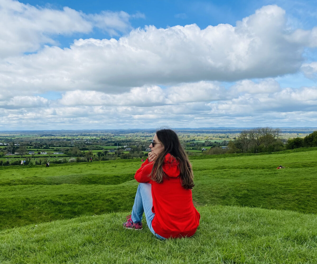 relaxing time in nature green hills lady enjoying the scenic views on Irish countryside rural Ireland